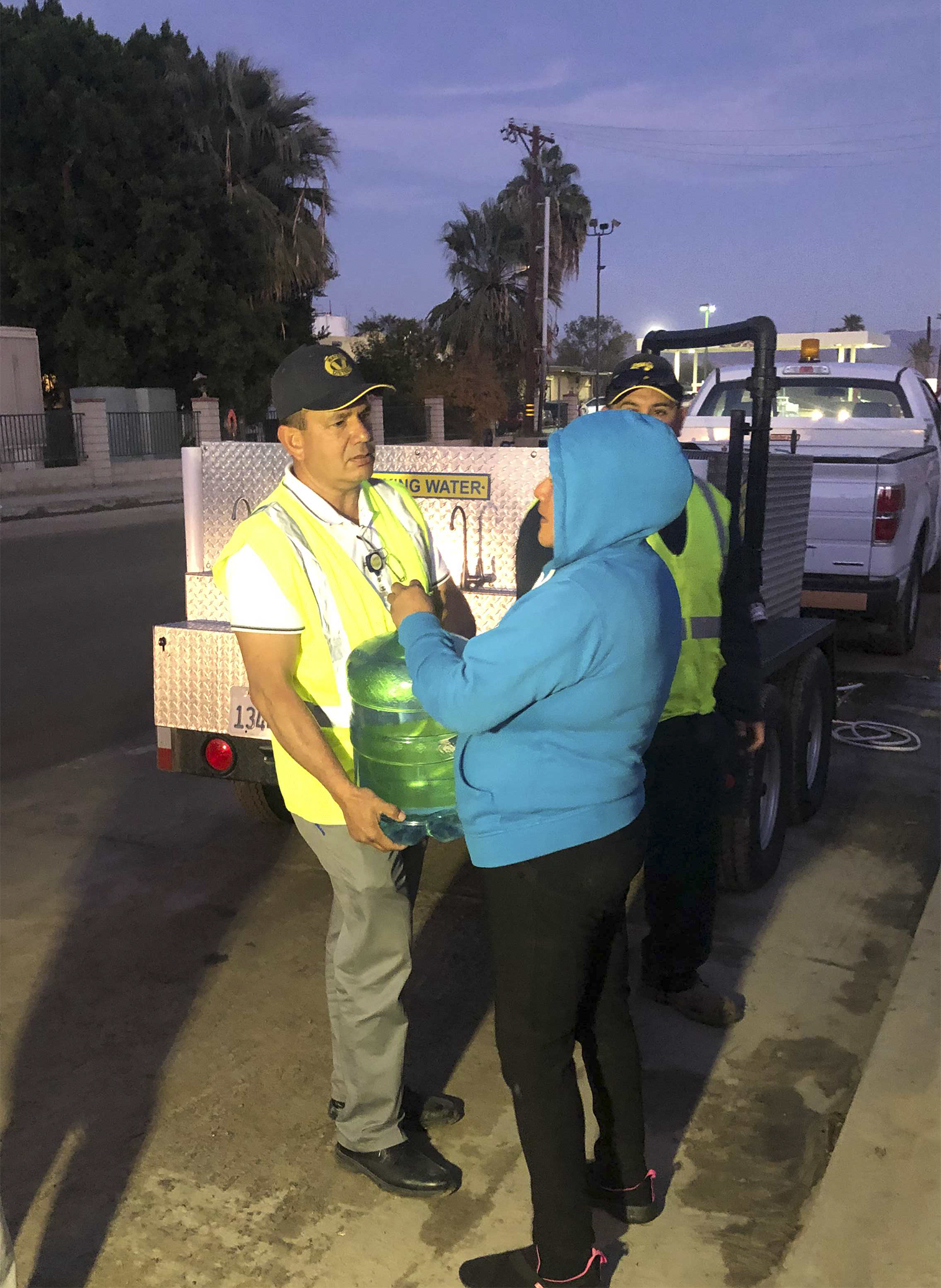 CVWD employee gives community member 5 gallon water jug