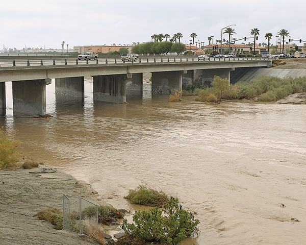 Stormwater Protection in Action - Water Rushing Below an Elevated Road Bridge